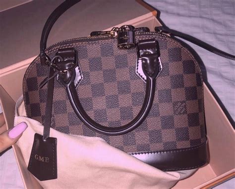 louis vuitton alma bb real vs fake|louis vuitton alma bag hardware.